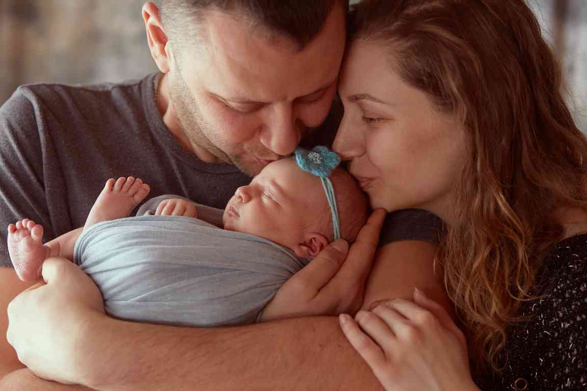 mother-father-embracing-daughter